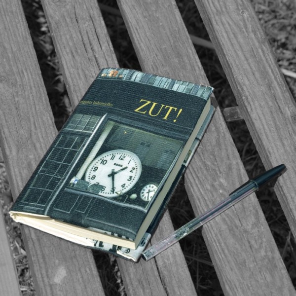Book cover shop of Paris "Zut"  placed on a bench - Maron Bouillie made in France