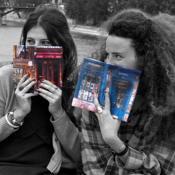 Paris shops fabric book covers in the hands of 2 young girls - Maron Bouillie made in France Paris shops fabric book covers in the hands of 2 young girls - Maron Bouillie made in France