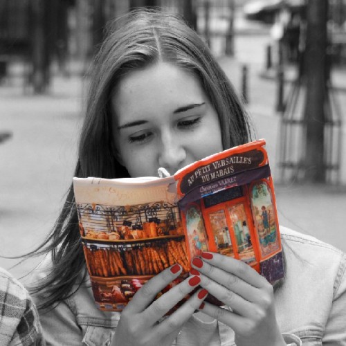 Paris Bakery Au petit Versailles du Marais fabric book covers in the hands of a young girls on a terrace - Maron Bouillie