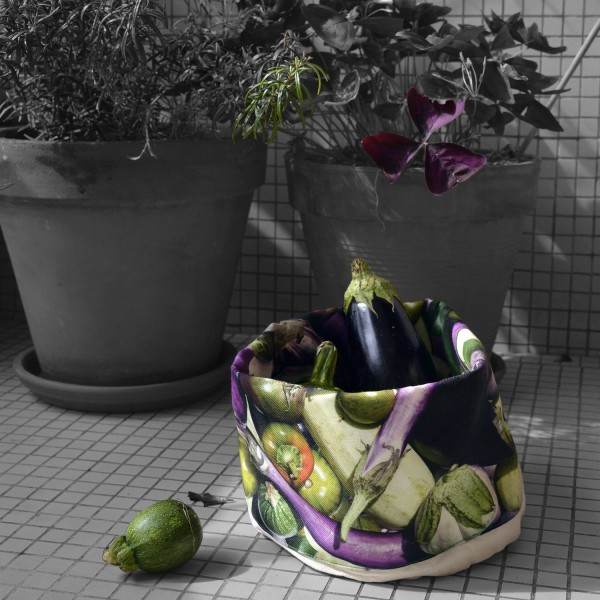 Eggplants vegetable basket on a balcony next to flower pots - Maron Bouillie made in France Eggplants vegetable basket on a balcony next to flower pots - Maron Bouillie made in France