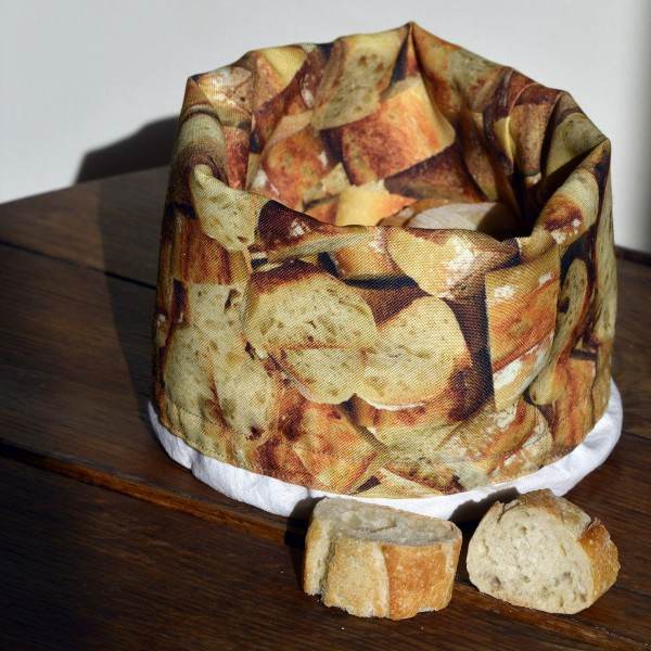 Basket bread of printed french baguette folded and placed on a wooden table - Maron Bouillie made in France