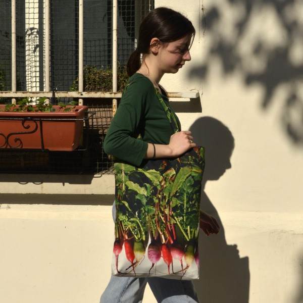 Young girl carrying the Maron Bouillie large Winter radishes large vegetable shopping bag