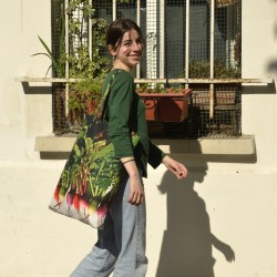 Smiling young Lady with the Maron Bouillie Winter radishes vegetable shopping bag. Market tote made in France
