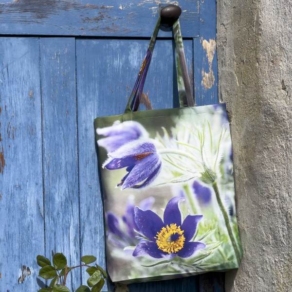 Anemone Flower Tote Bag hanging on a blue door - Designer Bag with Floral Print by Maron Bouillie Made in France