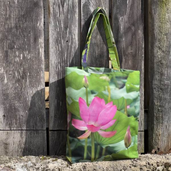 Oriental Lotus Flower Bag placed in front of a wooden door - Fabric Tote Bag by Maron Bouillie Made in France