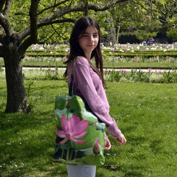 Young girl in a garden carrying the Lotus d’Orient Flower Bag by Maron Bouillie - Made in France