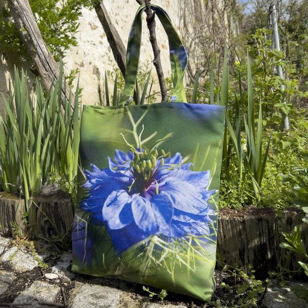 Damascus Nigella Flower Tote Bag in a garden - Designer Bag with Floral Print by Maron Bouillie Made in France