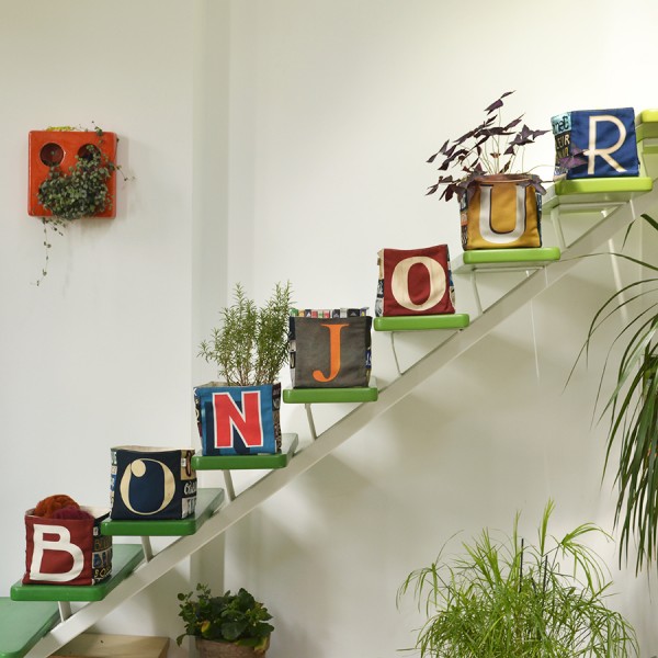 Maron Bouillie home goods baskets on a staircase forming the word Bonjour