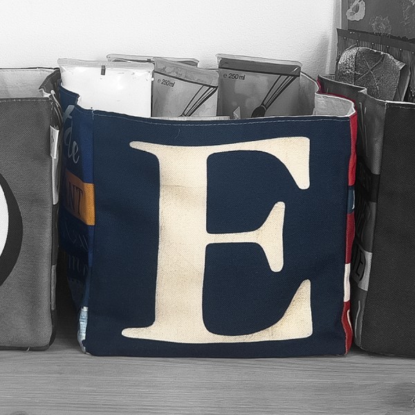 Alphabet letter box E used as a pocket emptier filled with papers  - Maron Bouillie made in France Alphabet letter box E used as a pocket emptier filled with papers  - Maron Bouillie made in France