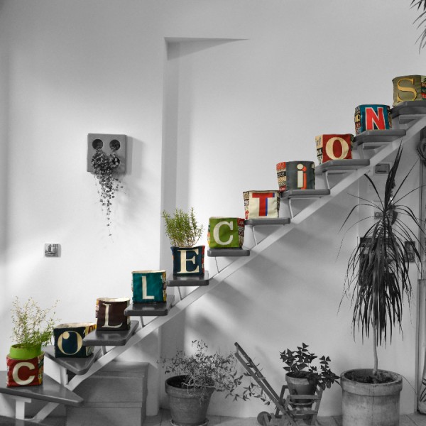 Maron Bouillie letter home goods baskets on a staircase forming the word COLLECTION