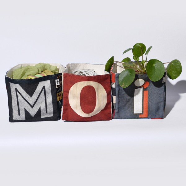 Home goods basket with letters of Maron Bouillie forming the word MOI