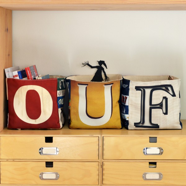 Maron Bouillie letter storage baskets placed on desk drawers forming the word OUF Maron Bouillie letter storage baskets placed on desk drawers forming the word OUF