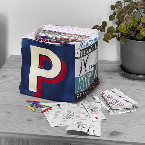 Alphabet letter box P on a table filled with notebooks and papers - Maron Bouillie made in France