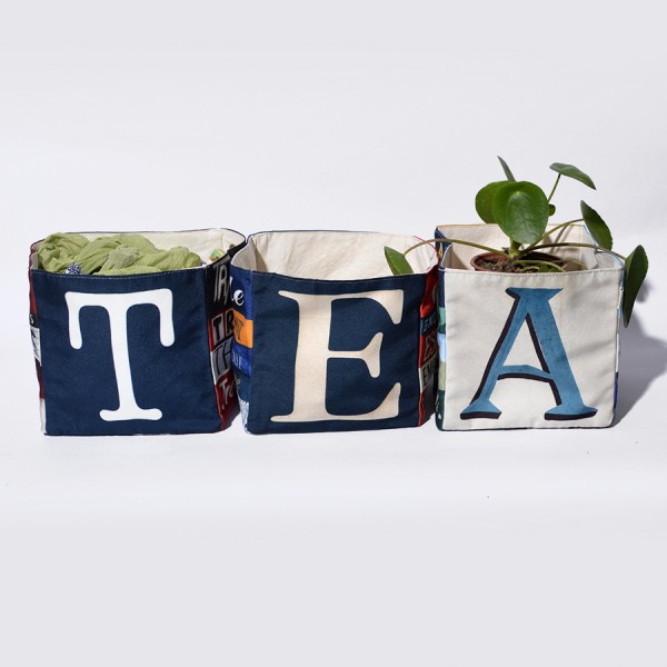 Maron Bouillie letter home goods baskets  forming the word TEA