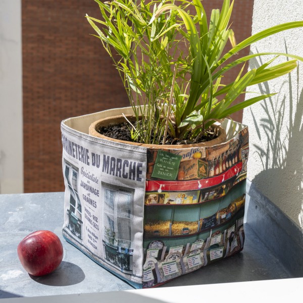Canvas storage basket Paris vintage shop Graineterie du marché Maron Bouillie with a plant on a windowsill. Gift from Paris