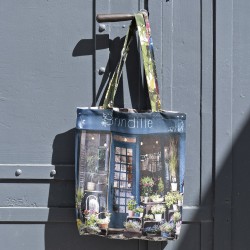 Paris tote bag, Fleuriste Brindille eco bag hanging from a door handle. Maron Bouillie made in France