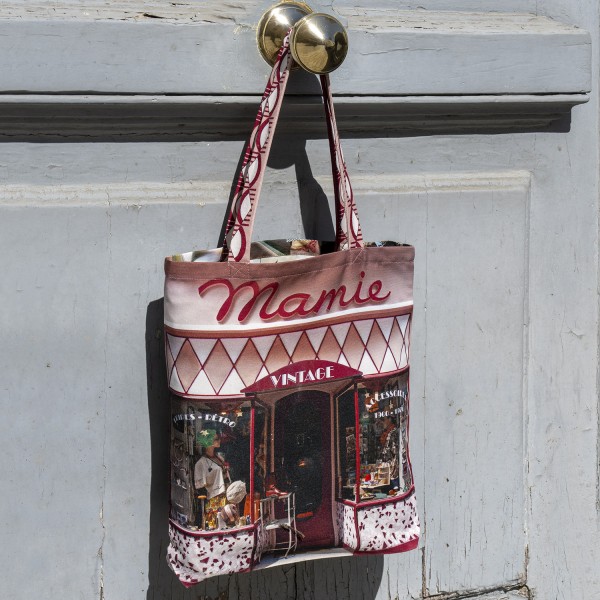 Vintage fashion tote bag from Mamie shopping in Paris hanging on a door. Maron Bouillie Made in France