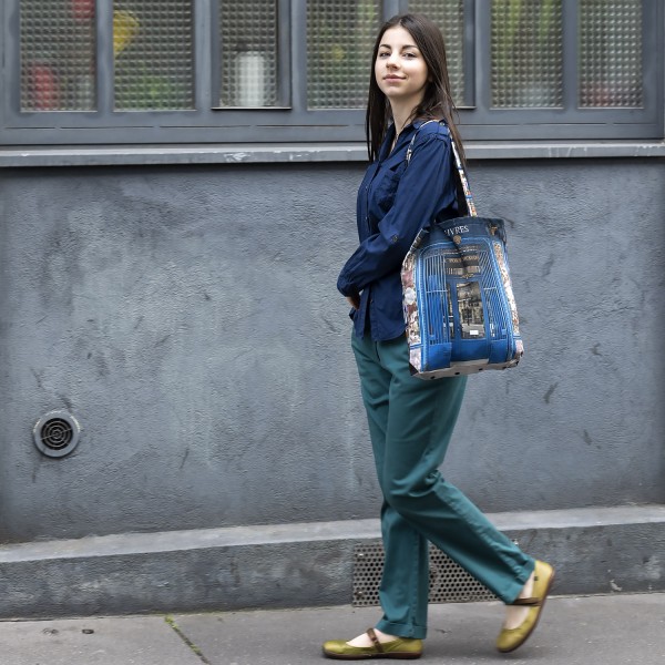 Young woman reusable shopping tote bag Retro Paris Bookstore Au pont traversé. Maron Bouillie tote bag made in France