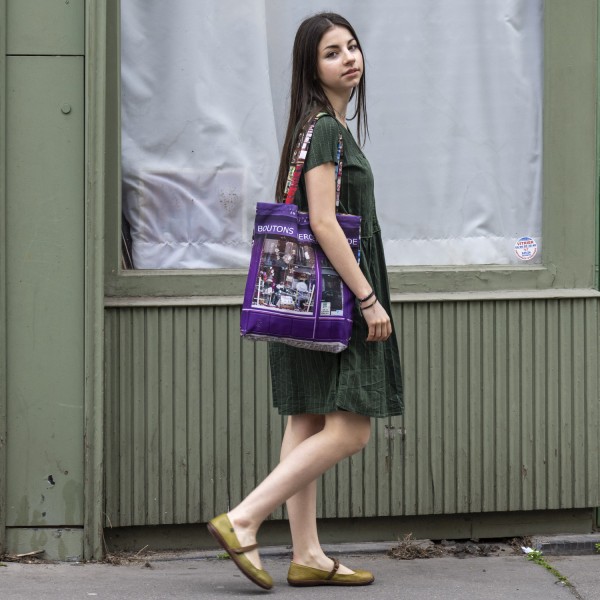 young girl with Paris canvas tote bag  Haberdashery Au mètre à ruban on her shoulder, made in France eco tote bag Maron Bouillie